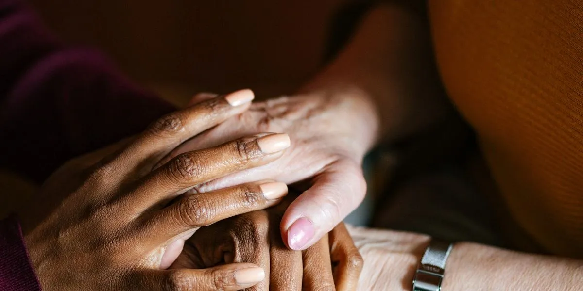 Close up of elderly senior hands representing compassion and care